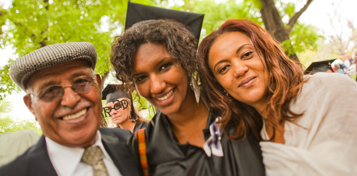 A student and their parents at graduation